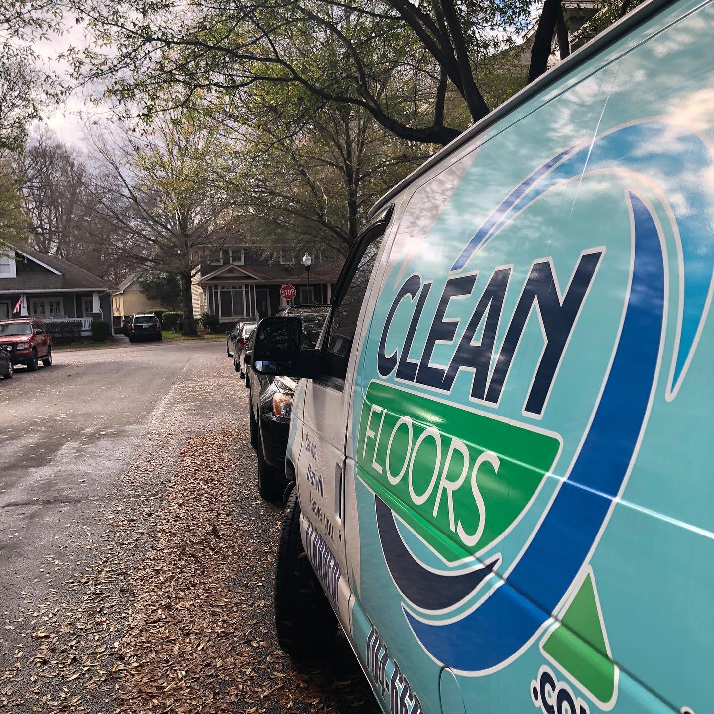 Clean Floors service van on a residential street